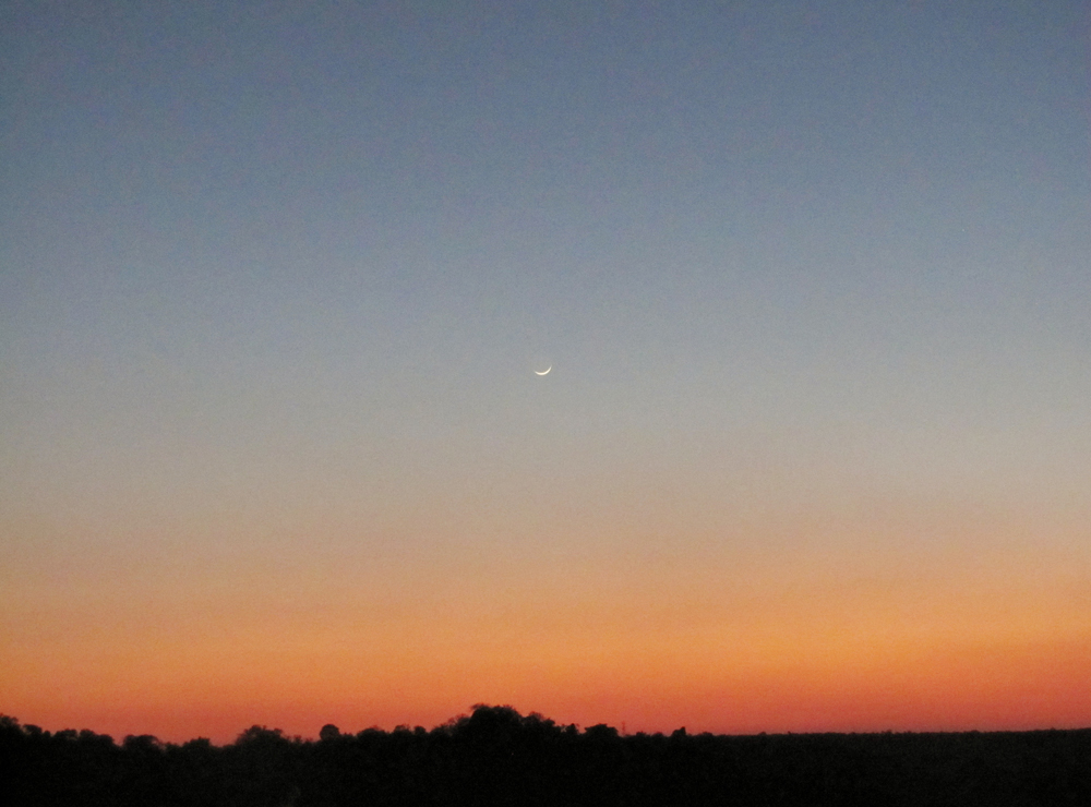 Moon begins to set, as sun begins to rise
