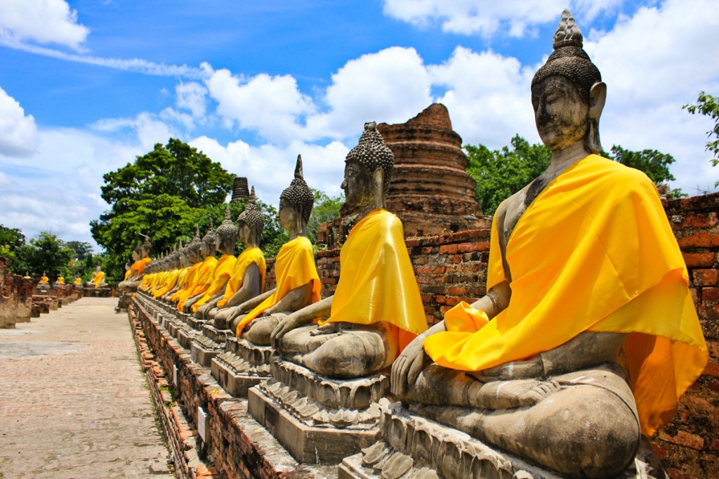 Buddha statues at the temple of Wat Yai Chai Mongkol in Ayutthaya near Bangkok, Thailand | Photo Credit: Shutterstock Buddha statues at the temple of Wat Yai Chai Mongkol in Ayutthaya near Bangkok, Thailand | Photo Credit: Shutterstock