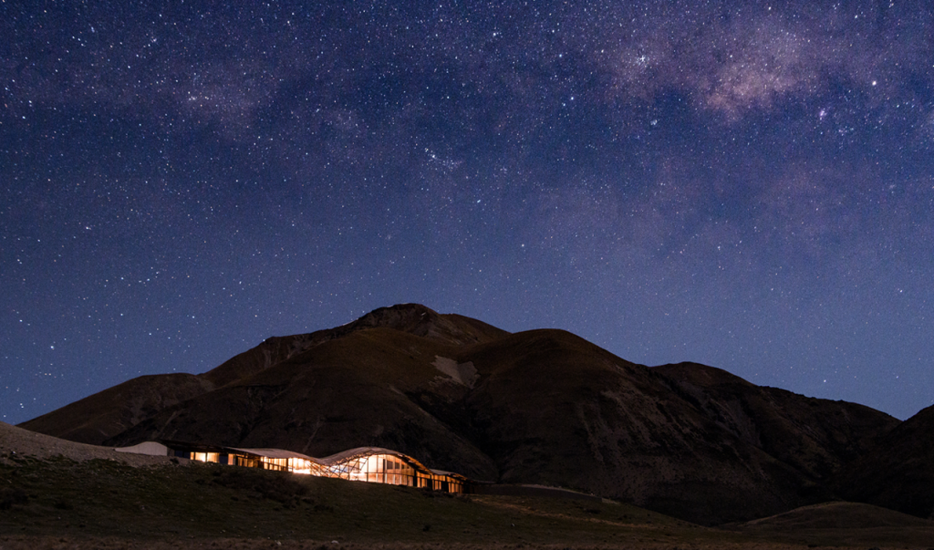 Image of The Lindis with a background of the mountains behind and the vast starry night