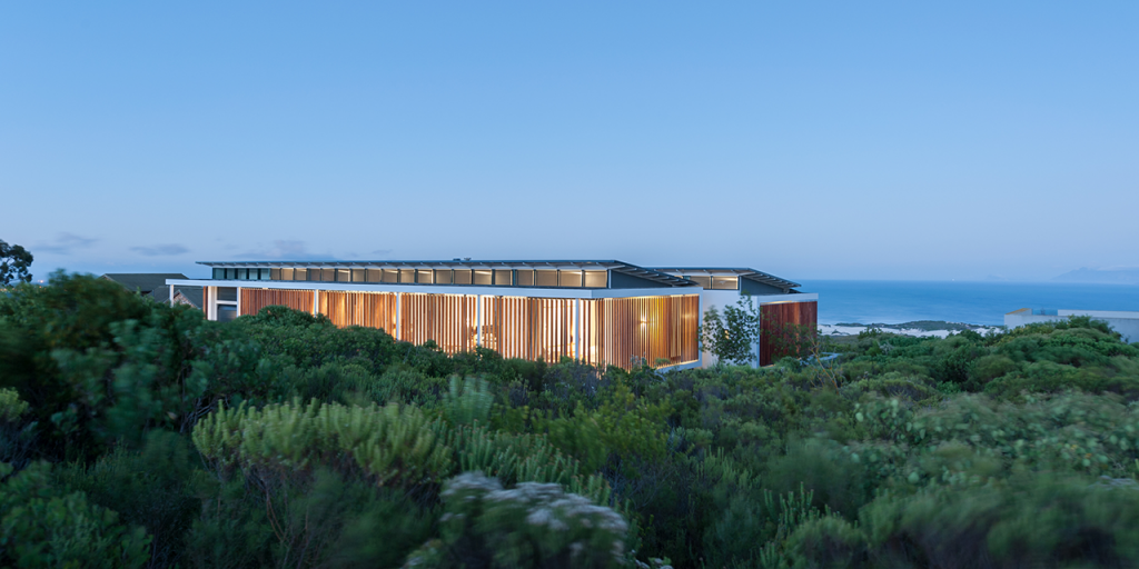 View of Grootbos Villa 2 in foreground with ocean in the background.